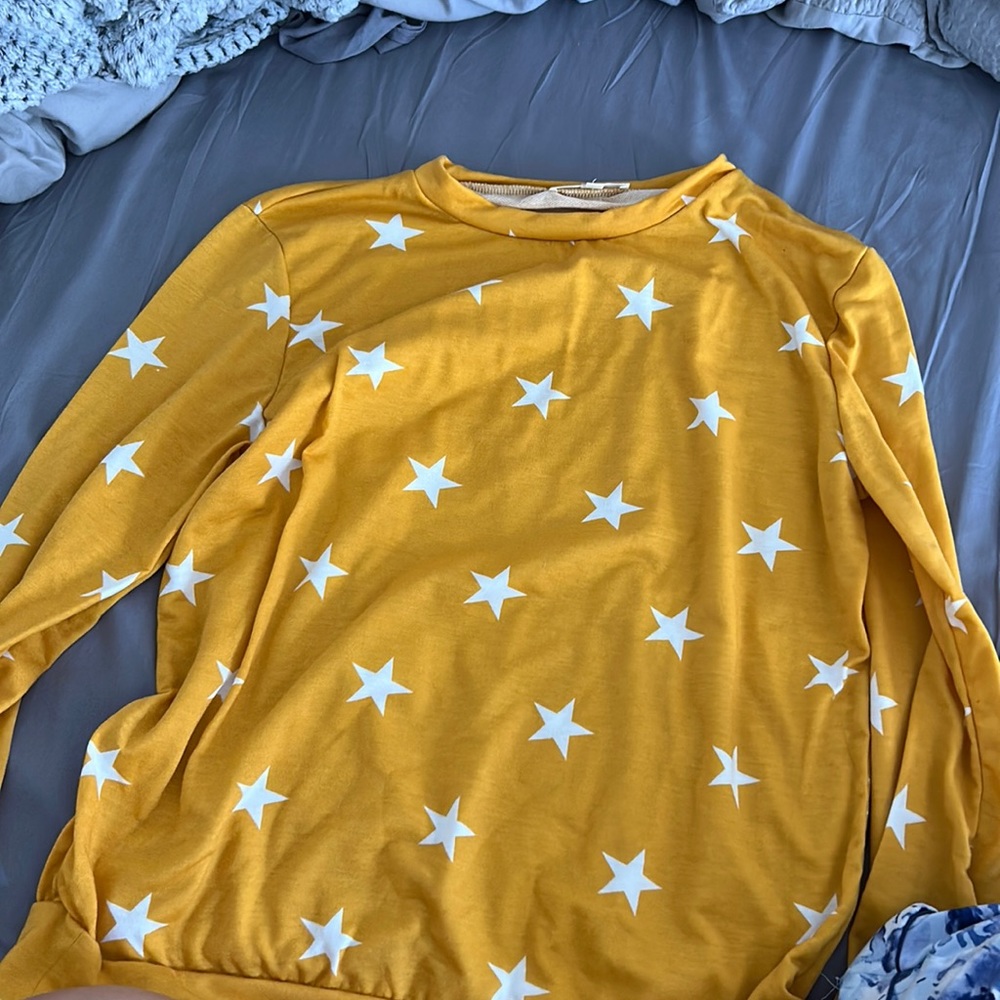 Yellow sweater with white stars